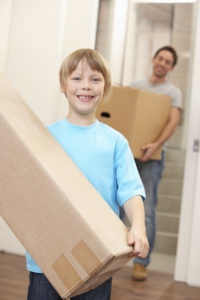 child with moving box