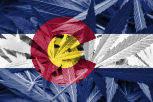 Colorado Flag on Cannabis background
